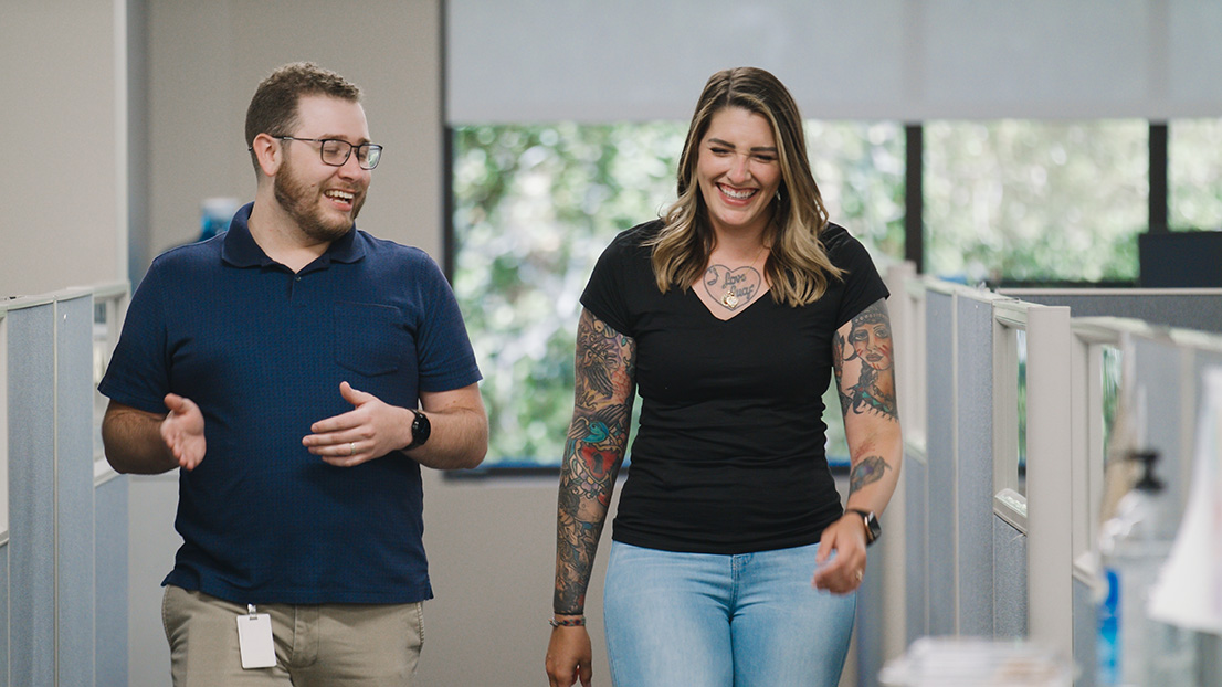 Two team members walking through the Folsom, California office